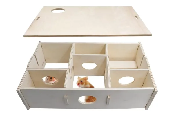 Wooden multi-chamber hide for hamsters with two Syrian hamsters inside
